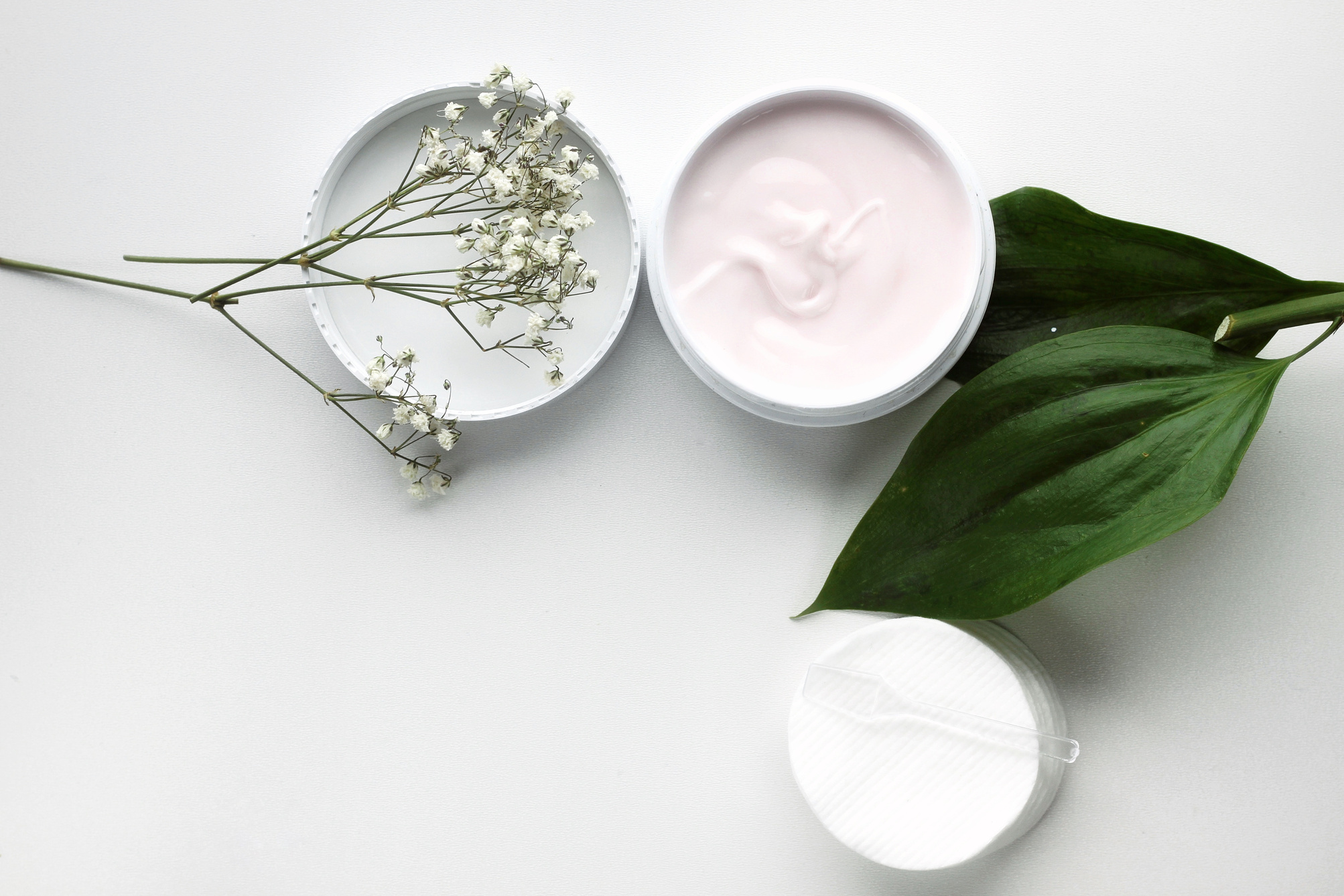 Organic skincare products on minimalistic background with copy space